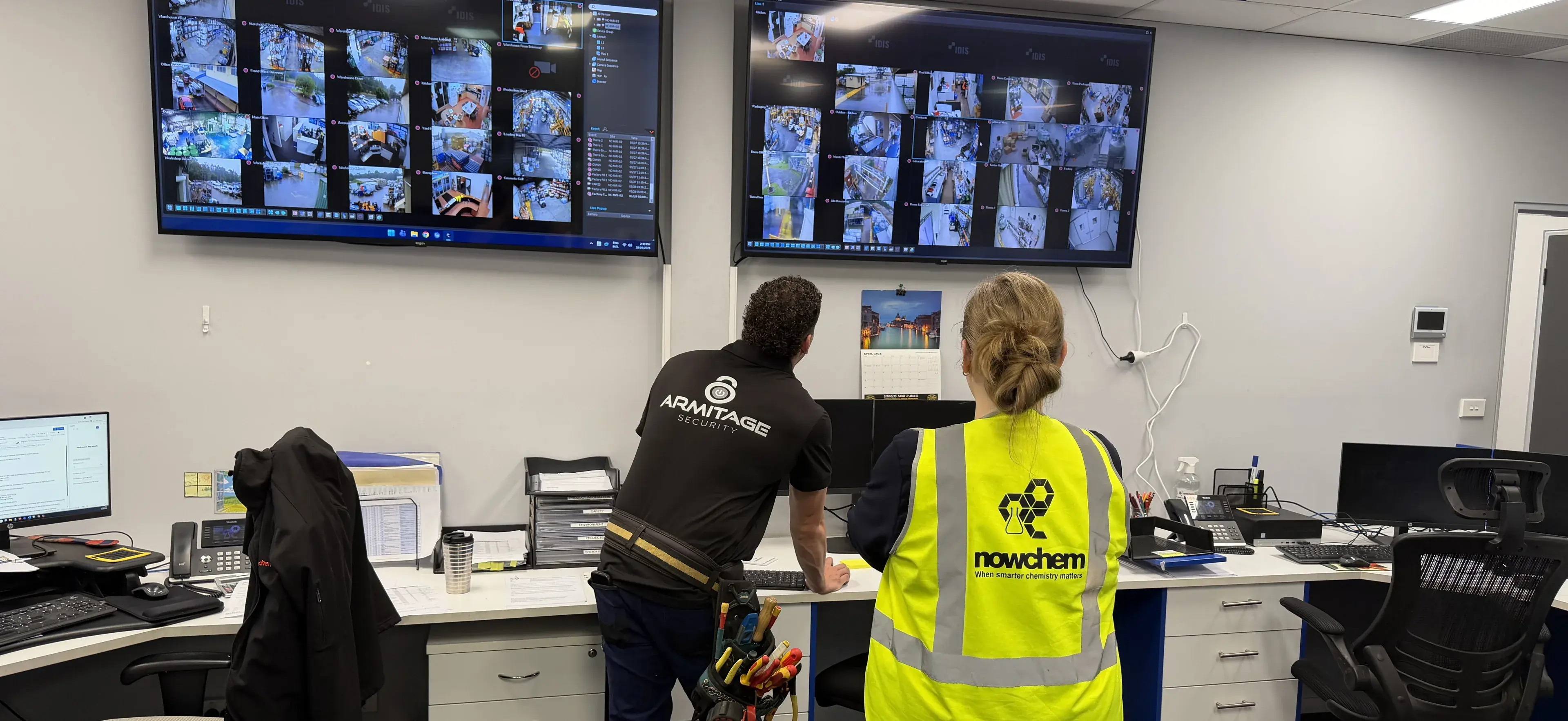 Armitage Security technician reviewing live CCTV footage with a client at their Nowra site