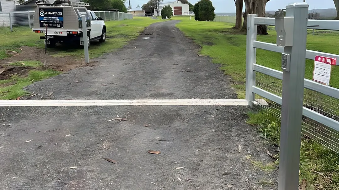 A gate intercom post on a rural Shoalhaven driveway, the Armitage Security ute at the gate