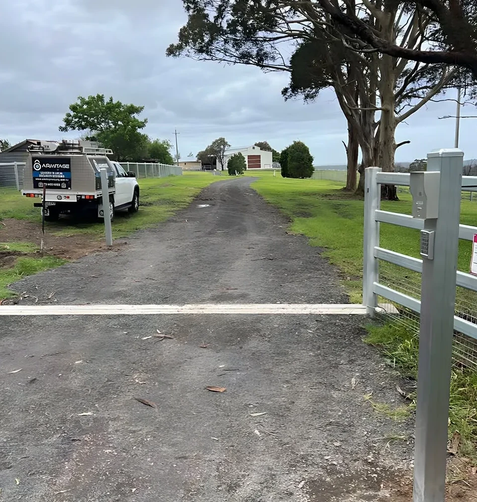 A gate intercom post on a rural Shoalhaven driveway, the Armitage Security ute at the gate