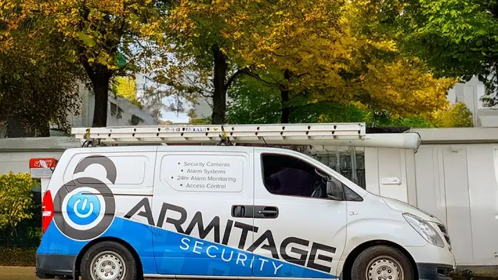The Armitage Security van parked on a tree lined street